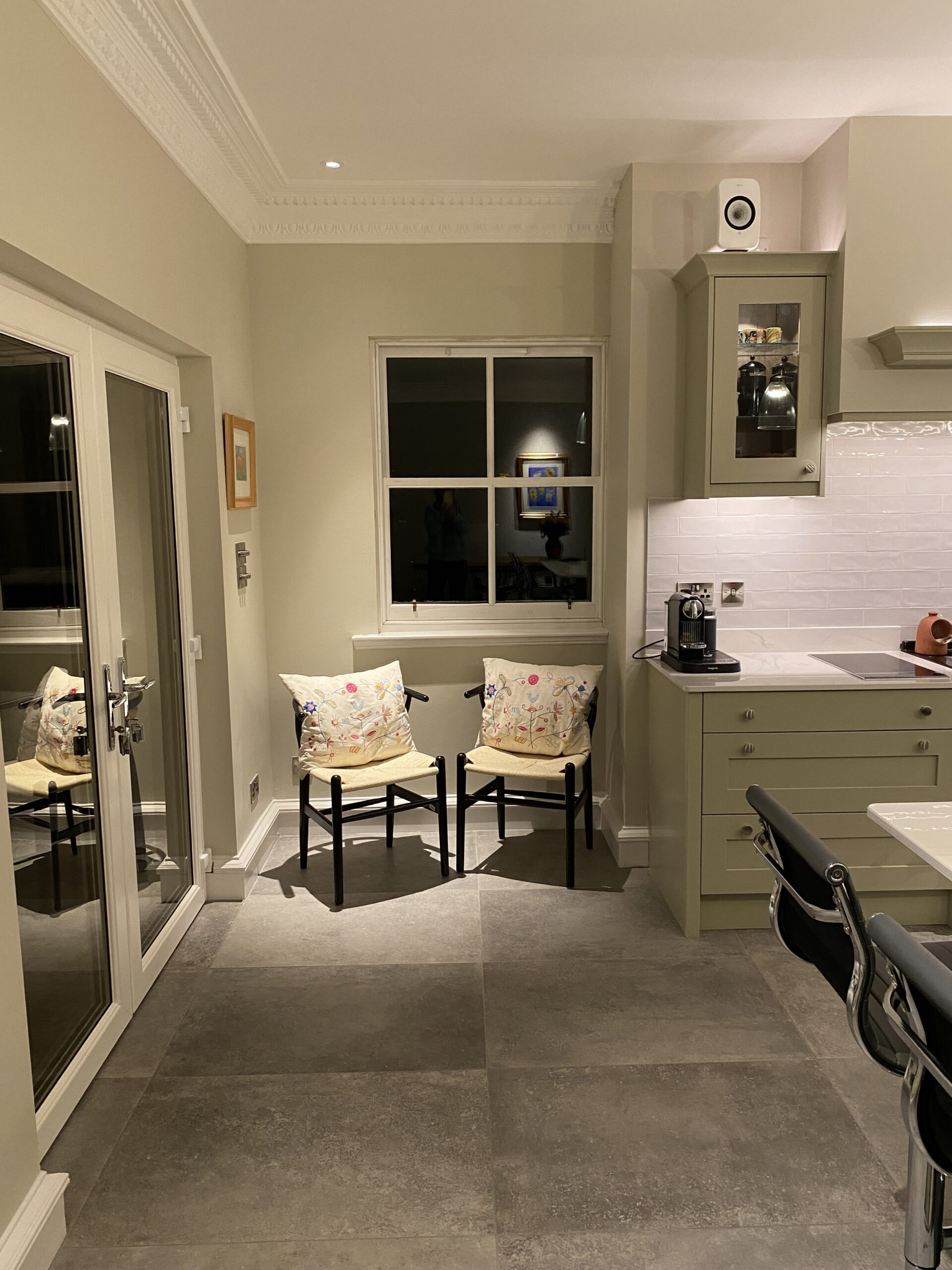 Top tips for cosy lighting in your home. A photo of a domestic kitchen interior with furniture and specialist lighting designed by Cat Lighting